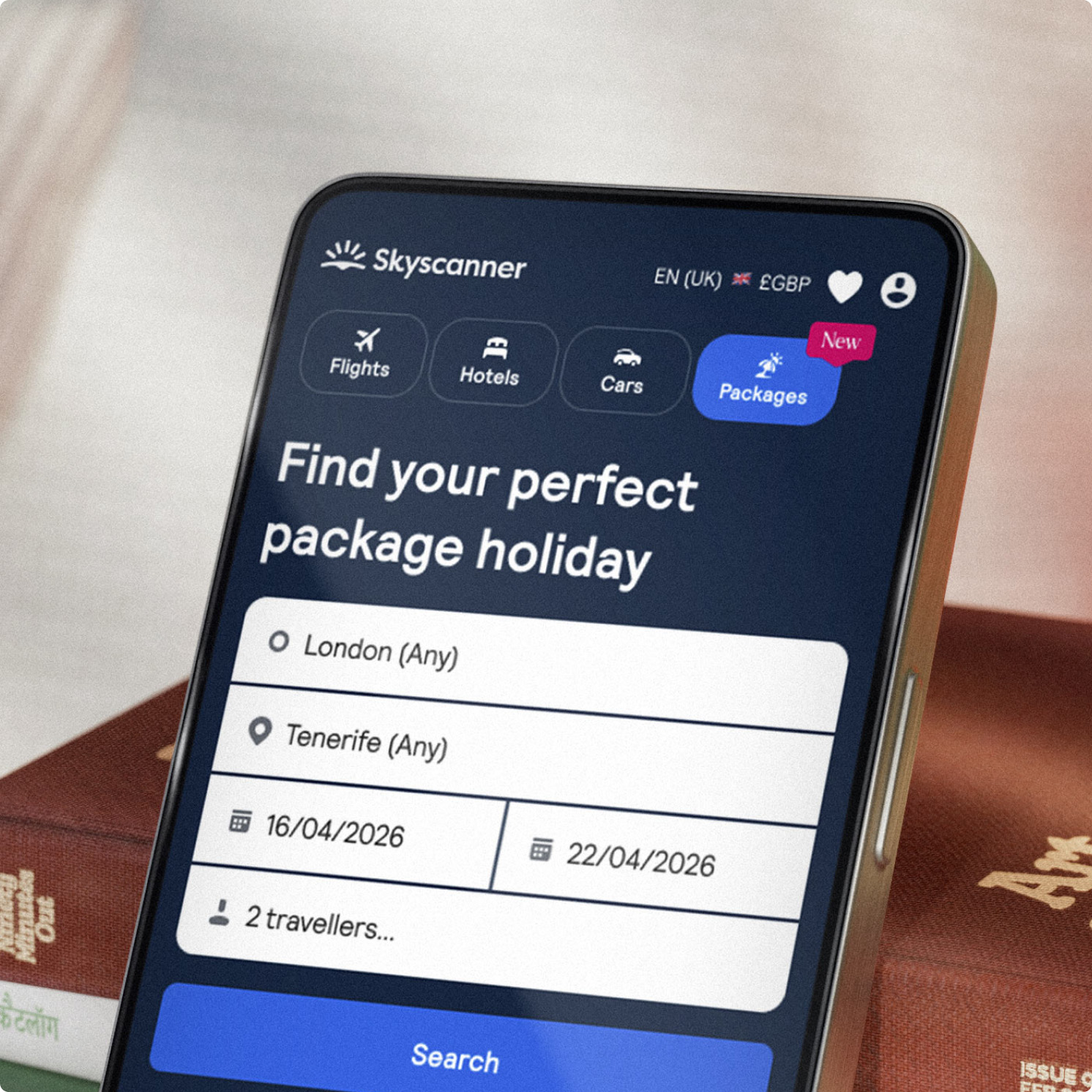 A smartphone showing the Skyscanner app Packages