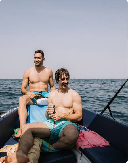 Two men sitting together on a boat